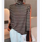 https://cdn.shopify.com/s/files/1/0826/7982/4718/files/4-main-loose-lazy-style-cashmere-bottoming-shirt-women-autumn-and-winter-2022-new-high-neck-long-sleeved-knitted-pullover-sweater.png?v=1718125089